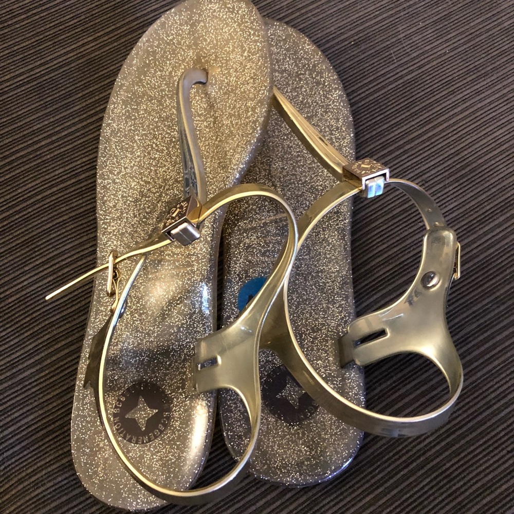 NEW NEVER WORN BCBGeneration Gold jelly sandals.